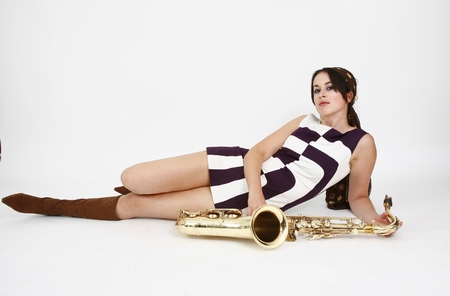 Kate  relaxes with her saxophone